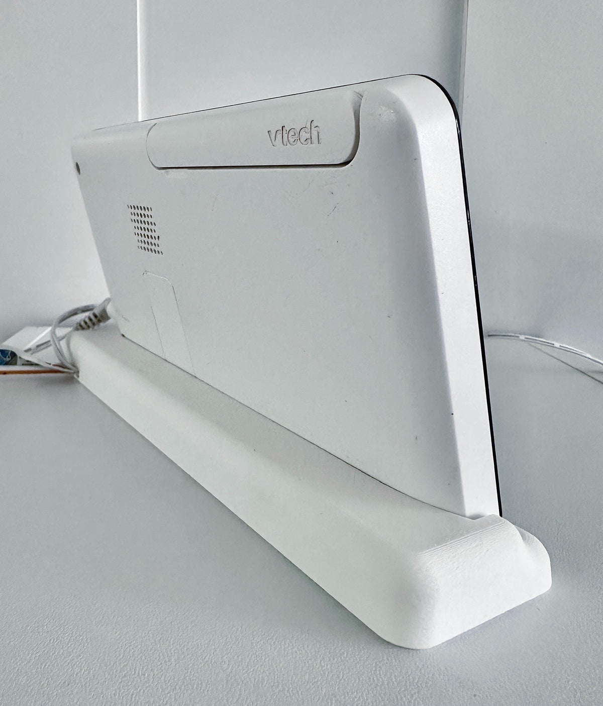 VTech Baby Monitor 7" Screen Dock | Cord Holder | RM7764HD & More mounted on a stable stand with charging cable.