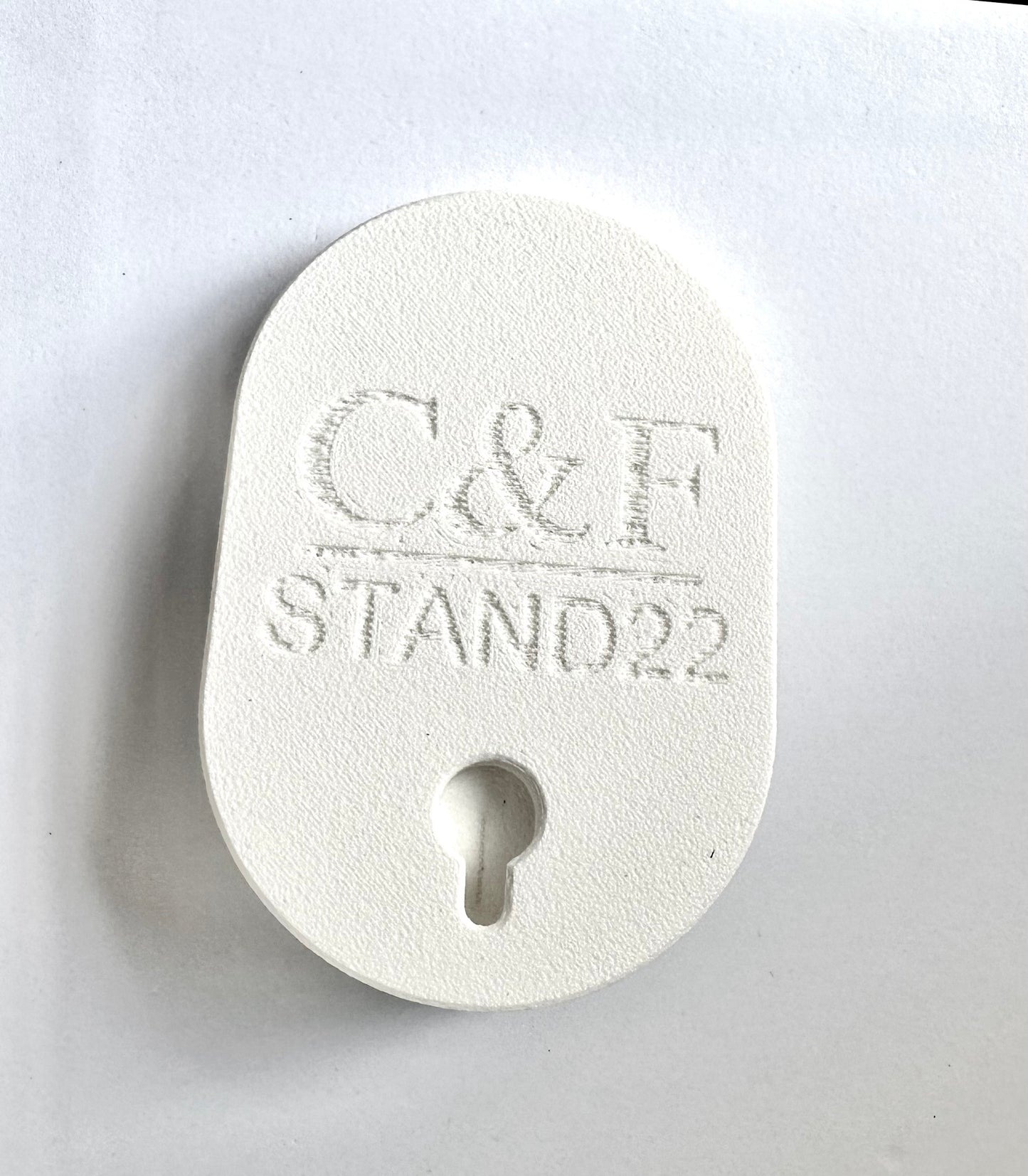 C&F STAND22 white wall mount adapter with keyhole design for secure installation