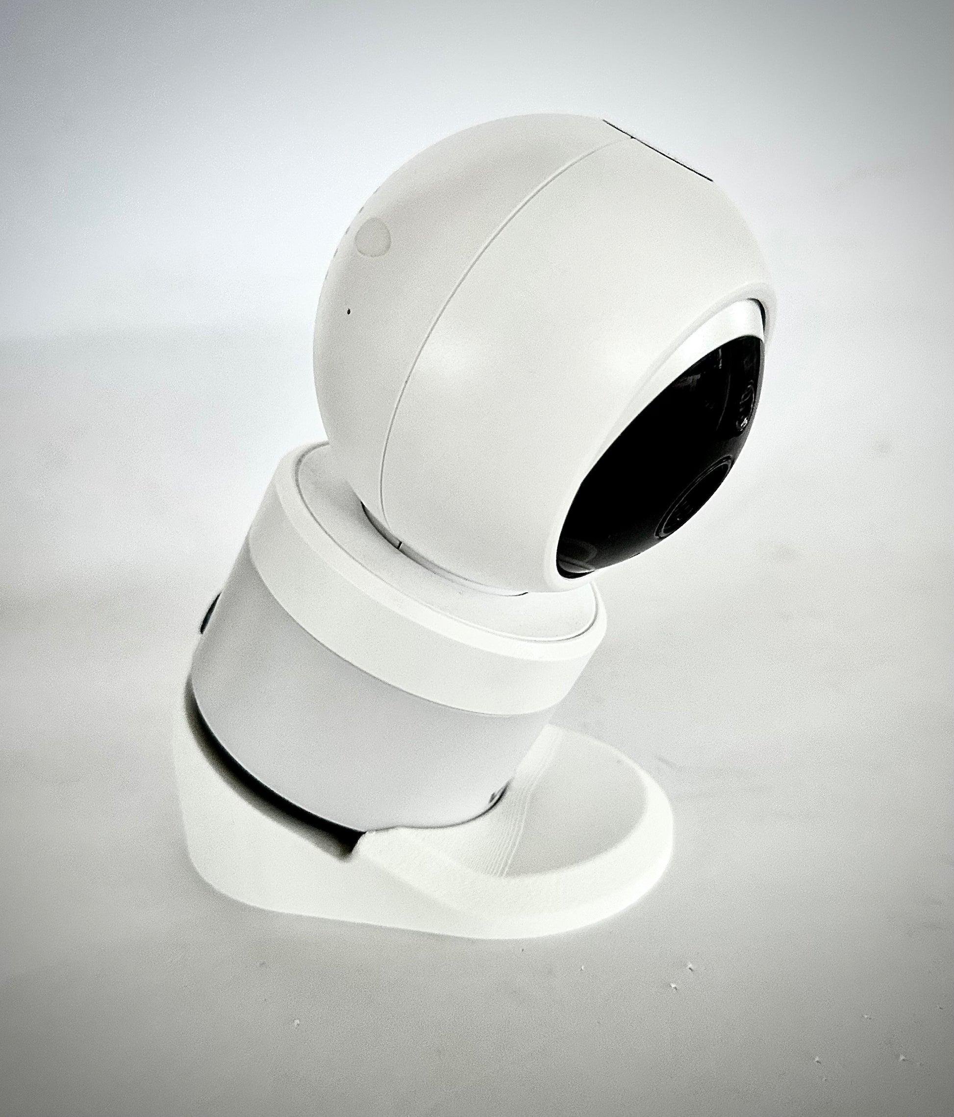 VTech Baby Monitor Shelf Mount | Angled | BM4700N & More displayed on a shelf, highlighting its compact design.