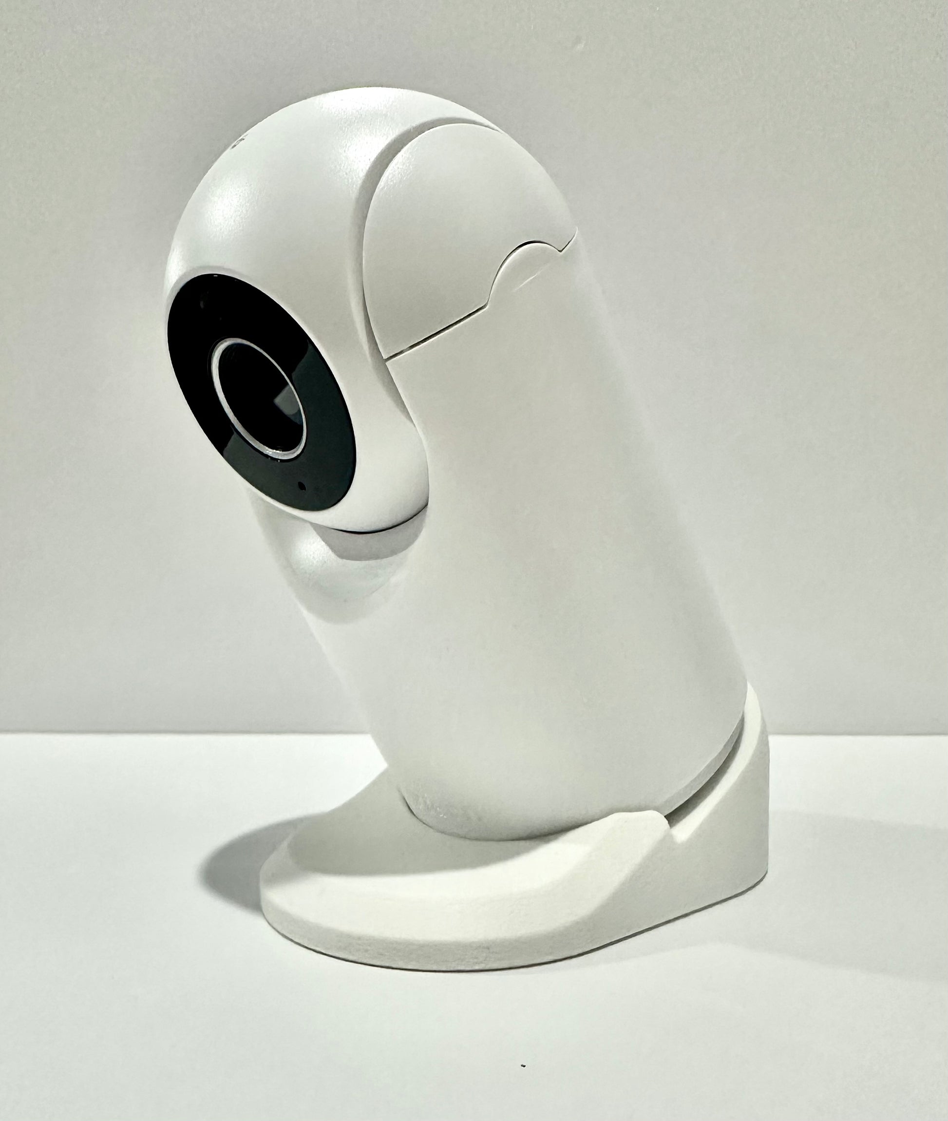 VTech Baby Monitor Shelf Mount | Angled | BM3900N & More camera mounted on a white stand, showcasing a stable design.