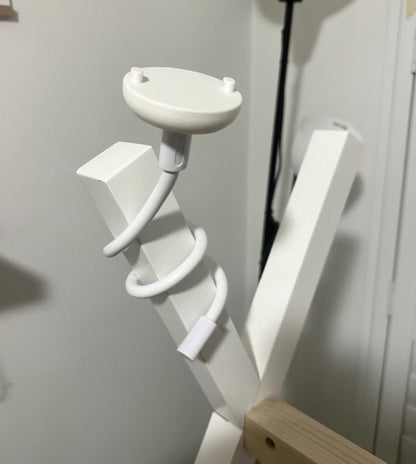 Universal Flexible Gooseneck Baby Monitor Mounting Arm (Standard 1/4 Inch Thread) installed on a wooden frame.