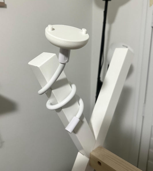 Universal Flexible Gooseneck Baby Monitor Mounting Arm (Standard 1/4 Inch Thread) installed on a wooden frame.