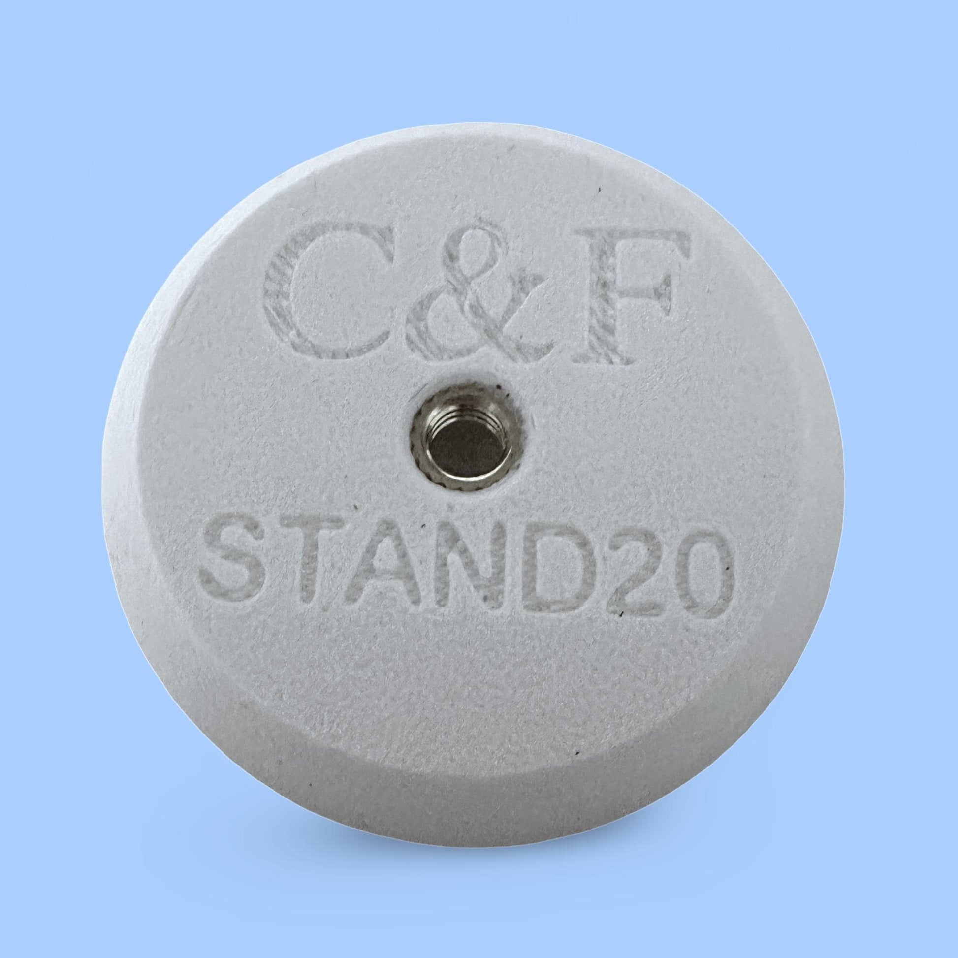 C&F STAND20 mount for compatible accessories. Circular design with threaded hole for secure attachment.