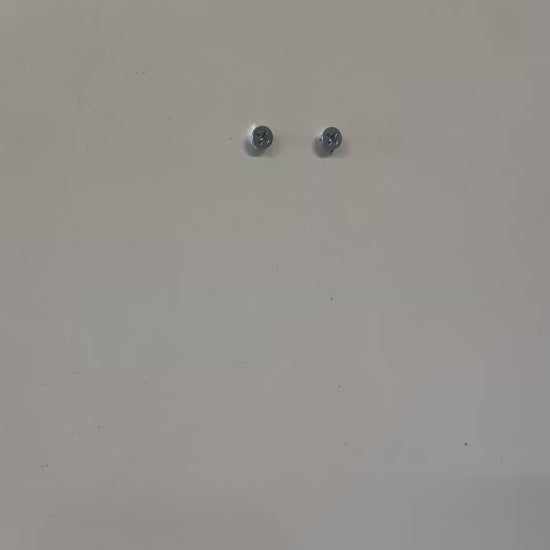 Screws mounted on a wall, ideal for VTech Baby Monitor Wall Mount | Angled | RM7766HD & More installation.