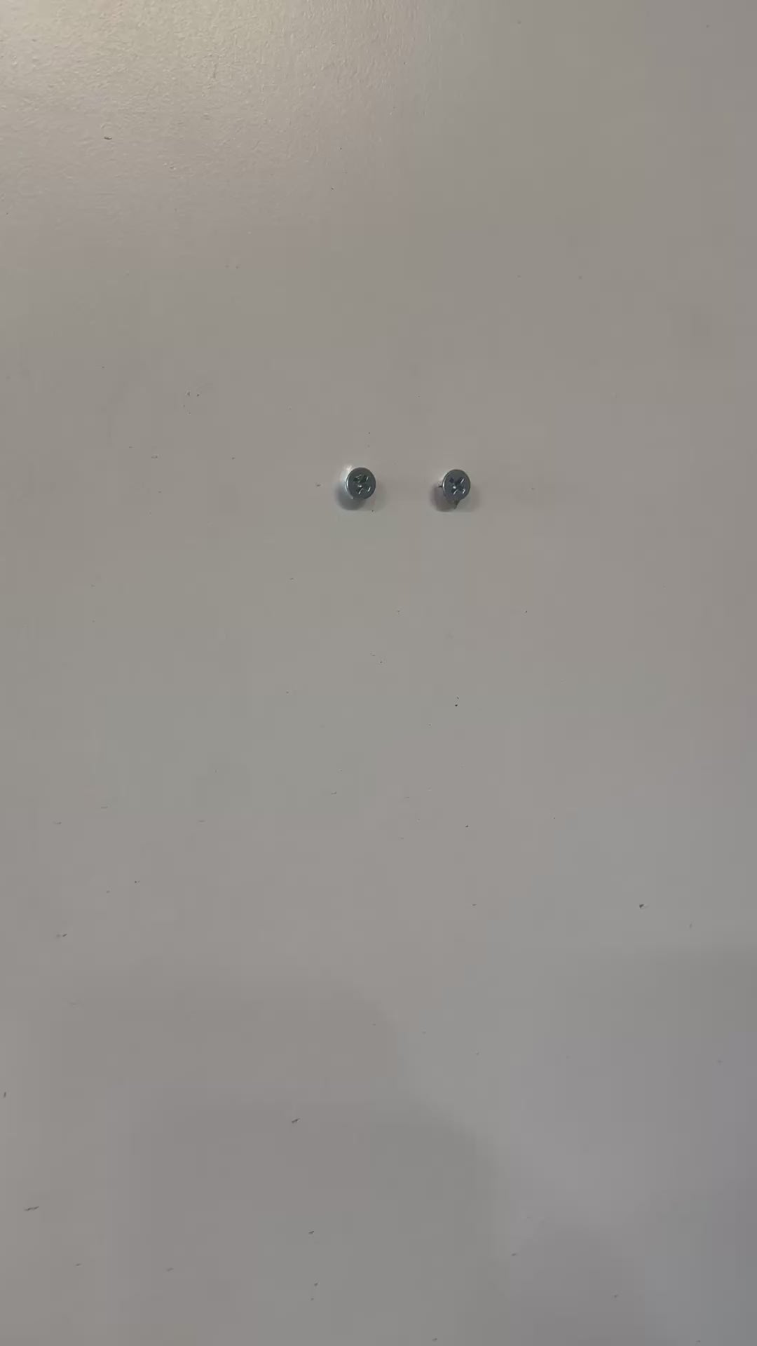 Screws mounted on a wall, ideal for VTech Baby Monitor Wall Mount | Angled | RM7766HD & More installation.