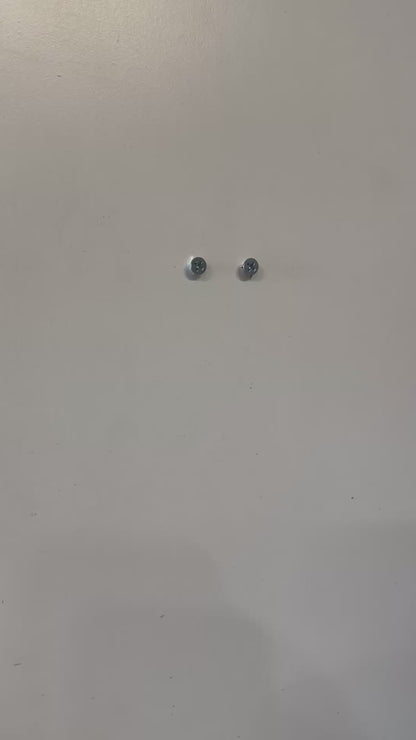 Screws mounted on a wall, ideal for VTech Baby Monitor Wall Mount | Angled | RM7766HD & More installation.