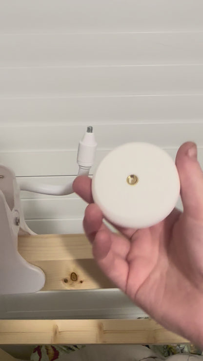 VTech Baby Monitor Mount Adapter | BM5850HD | 1/4" Thread being held, showcasing its design for baby monitor mounts.