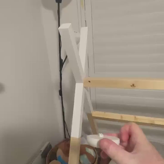 Eufy Baby Monitor Mount Adapter | E210 | 1/4" Thread attached to cot mount with lamp and wooden frame in background.