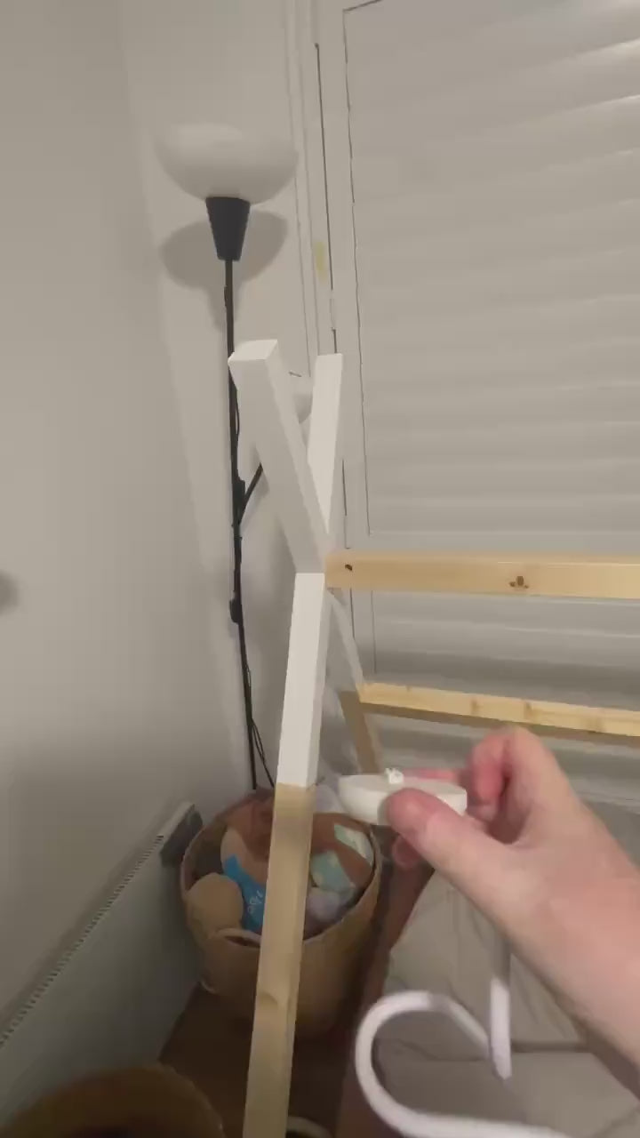 Eufy Baby Monitor Mount Adapter | E210 | 1/4" Thread attached to cot mount with lamp and wooden frame in background.