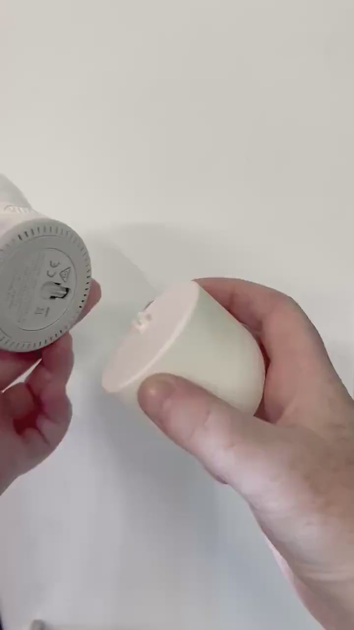 close-up of hands holding the Eufy Baby Monitor Wall Mount | Angled | E210 for installation on the wall