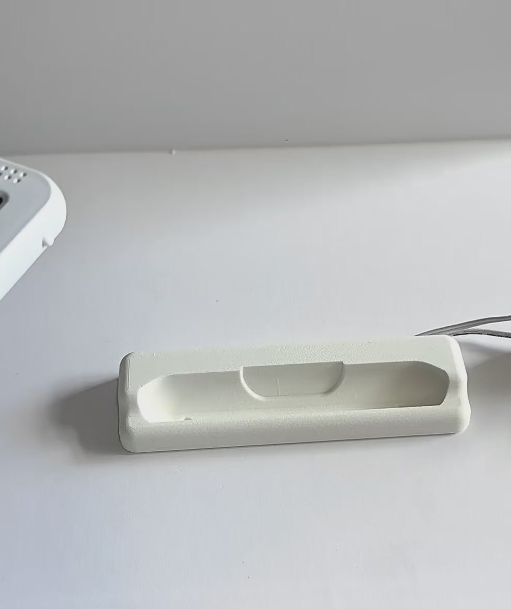 Oricom Baby Monitor Screen Dock | Cord Holder | SC875 on a flat surface with charging cable.