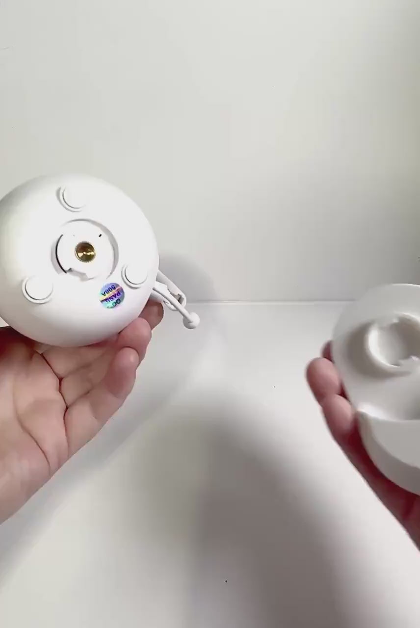 Tweetycam Baby Monitor Shelf Mount | Angled | All Models shown in hands for easy installation.