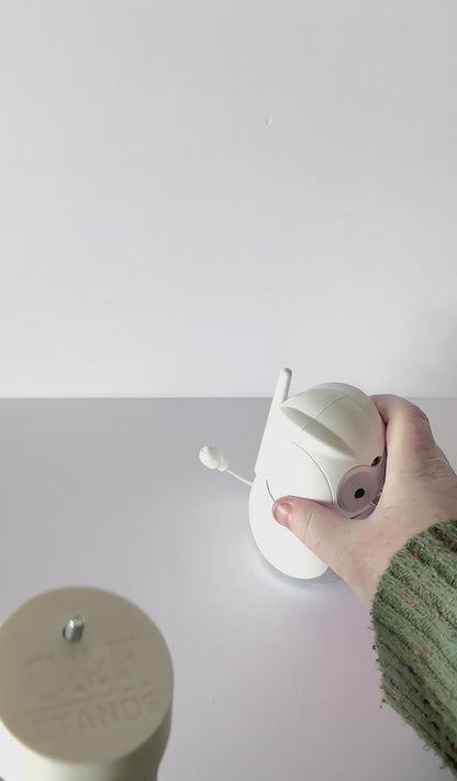 VTech Baby Monitor Snoo & Cot Mount | BM4500HD + More being held, showcasing the no-drill baby monitor mount design.
